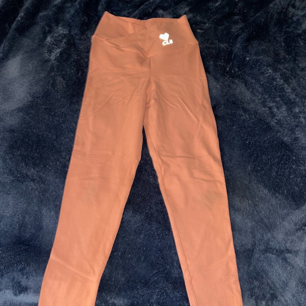 CLS leggings, size XS, color is peachy pink